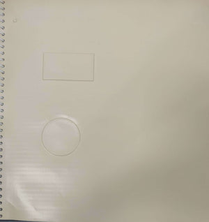 page of book with an embossed circle and rectangle