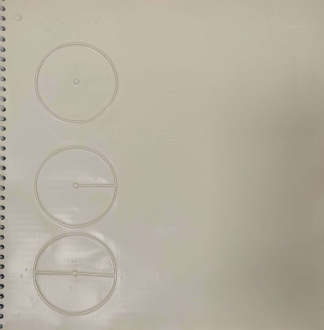 Page of the book with embossed circles